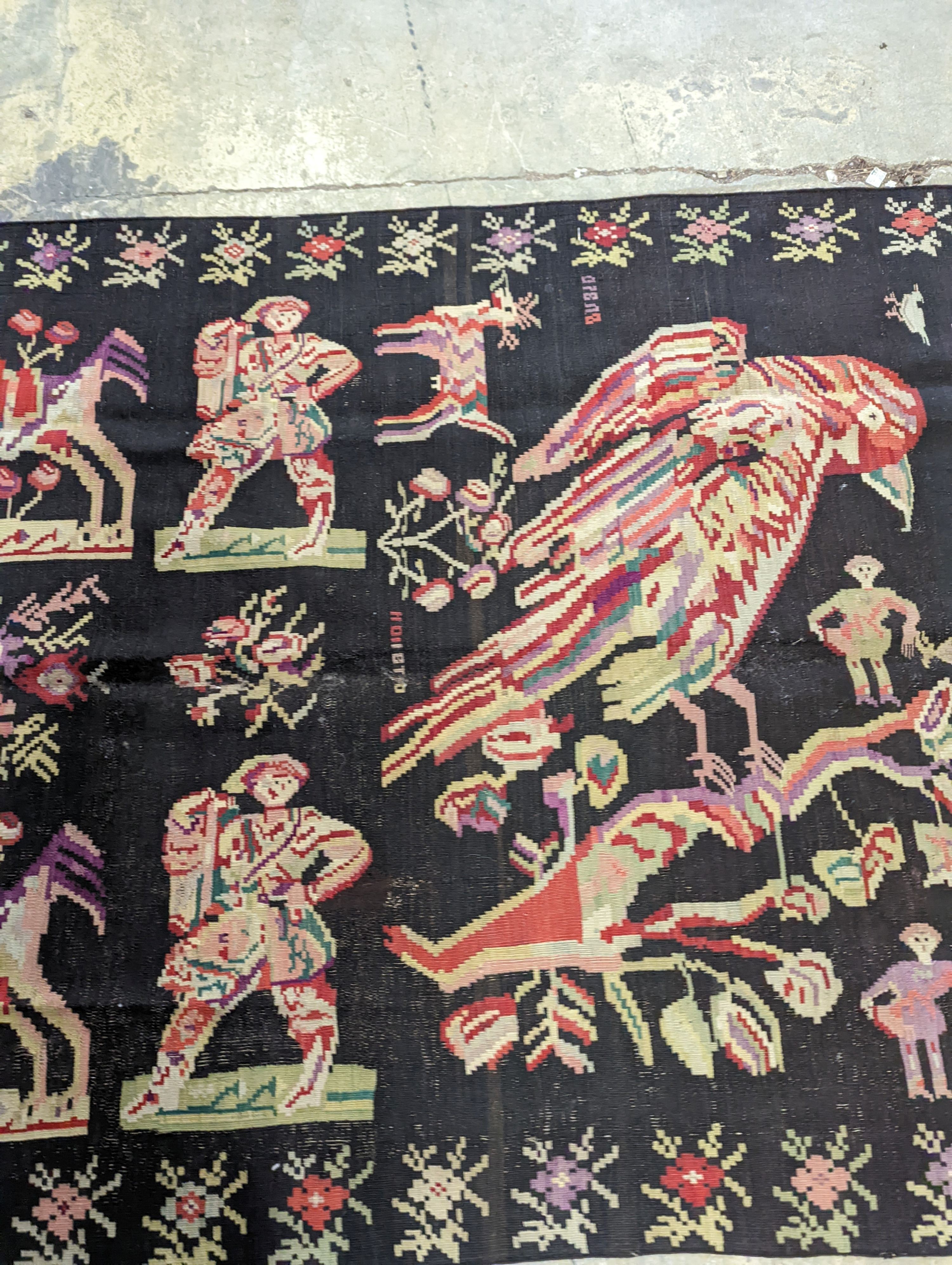 An antique Ukranian flatweave carpet woven with figures and birds, approx. 350 x 170cm